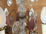 a chandelier that has a lot of glass hanging from it