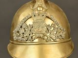 an old gold helmet with a crown on top of it
