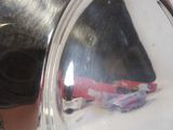 a reflection of a car in a mirror on the side of a car
