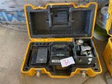 a yellow case with two different tools inside of it
