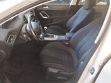 the interior of a white car with black seats and a steering wheel