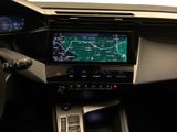 the dashboard of a car with a gps device in the center of it