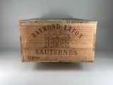 a wooden box with a label on it on a table