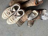 two pairs of shoes that have been left on the floor