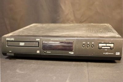 the dvd player is sitting on the table ready to be used