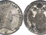a close up of a silver coin with a picture of a man on it