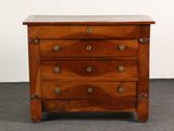 an old wooden chest of drawers with a marble top