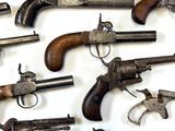a lot of old guns that are on the table