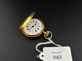 a close up of a pocket watch with a price tag attached to it