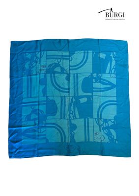 the blue scarf has a picture of people on bicycles on it