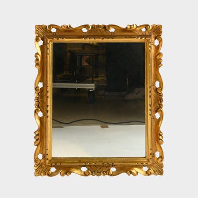 a mirror that is sitting on the wall in the room