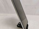 a close up of a tablet computer on a stand on a table