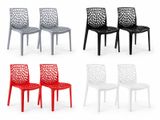 a set of four chairs with different colors of plastic
