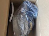 a cardboard box with a plastic bag inside of it