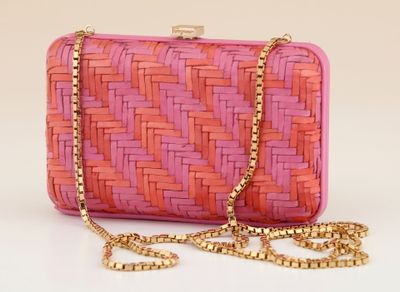 pink and orange clutch bag with gold chain strap