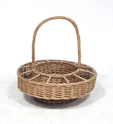 a close up of a wicker basket on a white surface