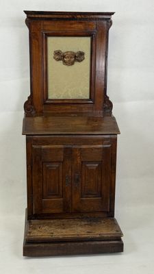 a small wooden cabinet with a clock on top of it