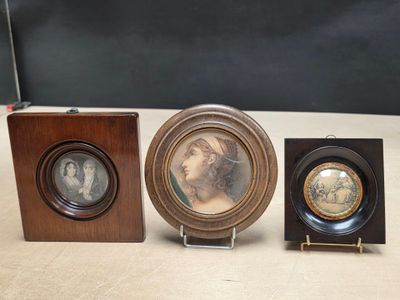 three framed pictures of a woman and a man in a wood frame