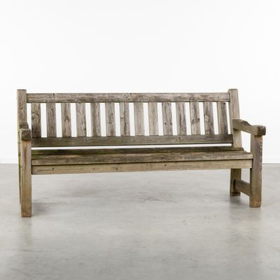 a wooden bench that is sitting in the middle of a room
