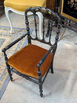 a chair that is sitting in front of a fire place