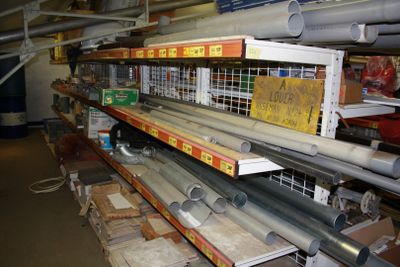 many metal pipes on the shelves in the store