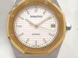 an image of a close up of a watch on a white surface