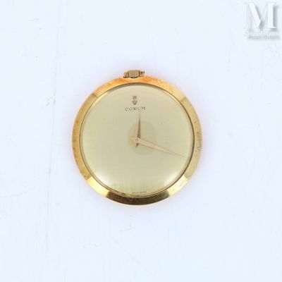 a gold watch with a white face on a white surface