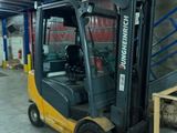 a forklift truck that is parked in a warehouse