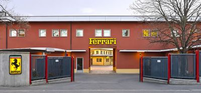 a red building with a yellow sign on the front of it