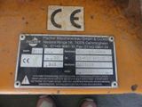 the label on the back of a machine that is sitting on the ground