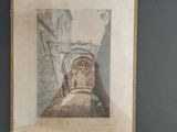 an old picture of a man walking down a narrow street
