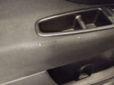 a close up of a car door handle with a cup holder in it