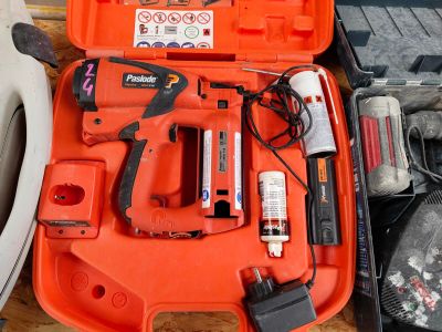 an orange tool case with tools in it on a table