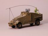 a toy army truck with a man on top of it
