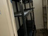 a small room with a shelf and shelves in it