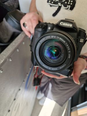 a person holding a camera in their hand