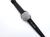 the watch is black and silver with a white face