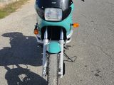 a motorcycle that is parked on the side of the road