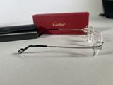 a pair of glasses sitting on a table next to a red box