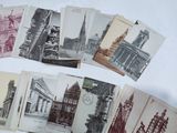a lot of old postcards that are on a table