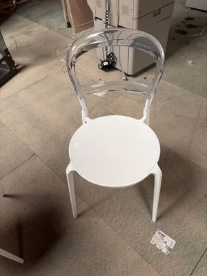 a white chair that is sitting in a room