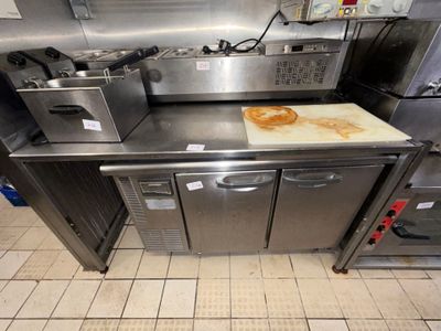 stainless steel counter top in a commercial kitchen with a lot of counter space