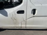 a white van that has some dirt on the side of it