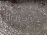a statue of a dog that is sitting on top of a table