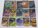 a bunch of pokemon cards sitting on top of a table