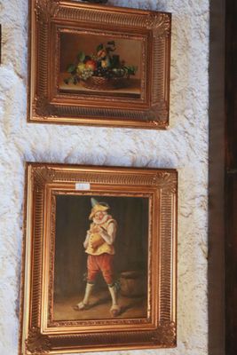 two paintings hanging on the wall of a room