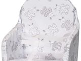 a high chair with a seat that has a pattern on it