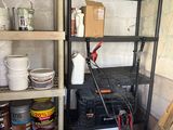a garage with shelves and tools in it