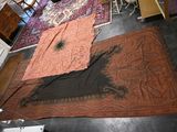 two rugs that are on the floor in a room