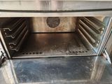 an open oven with a lot of food inside of it